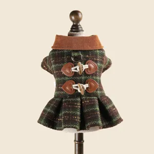 Detailed view of the green plaid pet dog dress featuring cute heart horn buttons and collar.