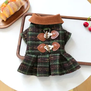Stylish plaid pet dog dress with corduroy collar and pleated skirt detail for small dogs.
