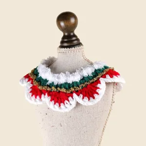Close-up detail of the handmade Christmas crochet pet collar featuring festive red, white, green.