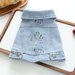 Cute puppy denim jacket with collar, leash ring and graffiti paint splatter design for small dogs.