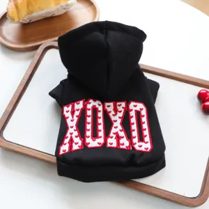 Black pet hoodie for small dogs, featuring embroidered XOXO lettering and comfortable warm fabric.