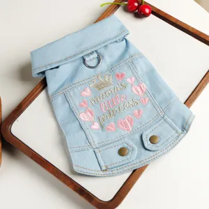 Cute denim dog jacket detail showing crown embroidery, lapel collar, and metal D-ring for small pets.