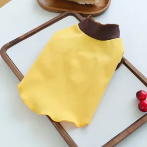 Close-up detail of the cute yellow and brown pet dog turtleneck bottoming shirt, soft fabric.