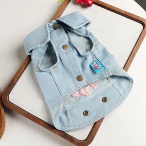 Cute pet denim vest for small dogs, stylish lapel design with heart embroidery and snap buttons.