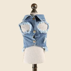 Pet denim vest for small dogs, fashionable lapel design with distressed frayed edges and metal buttons.
