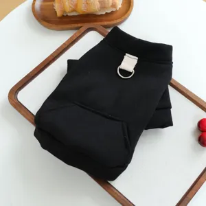 Detail view of black pet hoodie with D-ring traction buckle and front pocket for puppy.