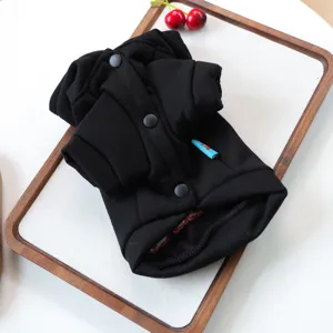 Black pet dog hoodie sweatshirt for small puppies, cute and comfortable apparel with buttons detail.