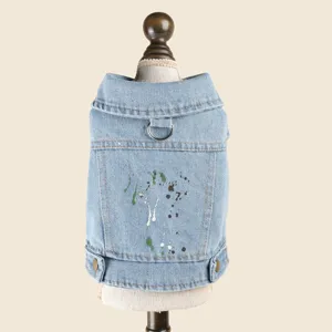 Pet denim jacket with paint splatter design, lapel collar and leash ring for small dogs.