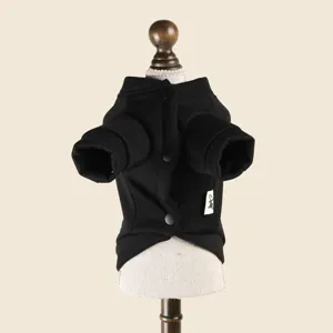 Black pet dog sweater detail view featuring soft fabric and classic button closure design.