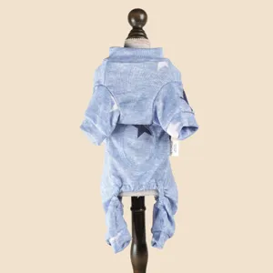 Blue pet jumpsuit detail featuring soft knit fabric and cute star print pattern close up.