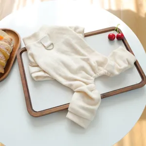 Soft beige pet pajamas for dogs and cats, cozy autumn winter pet clothes detail view.
