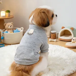Detail view of a cute puppy wearing a comfortable grey pet hoodie with a convenient pocket design.