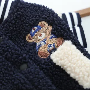 Pet fleece baseball uniform jacket detail, cute embroidered bear design, warm and cozy winter pet apparel.