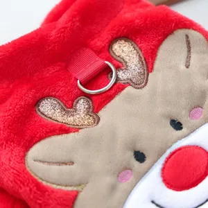 Cute plush pet Christmas coat detail showing reindeer antlers and soft red fleece fabric.
