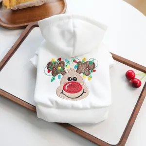 Cute Christmas pet dog hoodie with festive reindeer embroidery, soft warm autumn pet apparel detail.