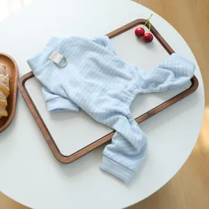 Detailed view of soft blue striped pet jumpsuit, comfortable homewear for small dogs.