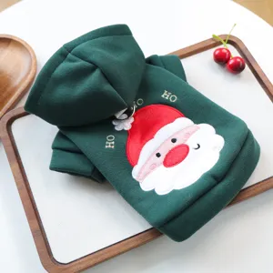 Detailed view of green pet hoodie with cute Santa Claus embroidery and festive holiday design.