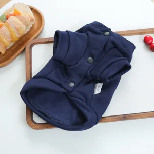 Dark blue pet hoodie detail view, showing snap buttons and brand tag for small dogs.