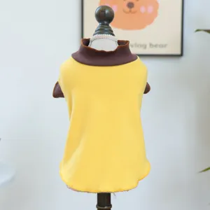 Detailed view of yellow and brown pet sweater, soft knit dog apparel with cute rolled collar.