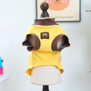Detail view of pet autumn t-shirt, yellow knit fabric with brown trim and cute bow detail.