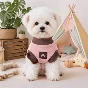 Detailed view of cute pet sweater in pink and brown with bow decoration for small dogs.