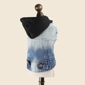 Pet denim jacket detail view showing classic washed blue fabric and stylish black hood.