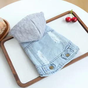 Stylish pet denim hoodie for small dogs, featuring grey hood, distressed details and buttons.
