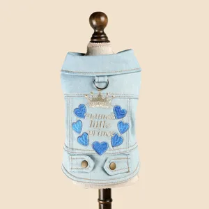 Detailed view of cute pet denim dog jacket with crown embroidery, stylish collar and buttons.