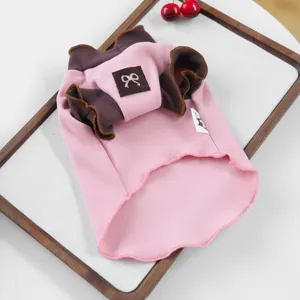 Cute pink pet dog sweatshirt with brown ruffles and bow detail, perfect for small dogs in spring.