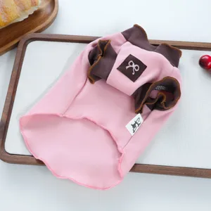 Cute pink pet dog clothes with brown trim and bow detail for small puppies spring autumn wear.
