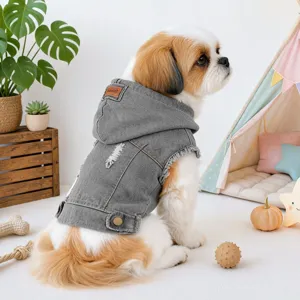 Detailed view of the stylish grey dog denim hoodie vest with ripped design and cute patch.