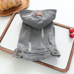 Grey denim pet hoodie close-up detail, distressed design with hood and metal buttons for dogs.