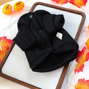 Black pet dog hoodie with front buttons and brand label, styled for Halloween season.