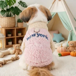 Detailed view of pink fleece puppy vest featuring new york embroidery for small dogs.