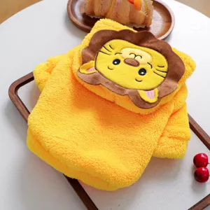 Close-up of cute yellow plush lion pet costume detail, displaying soft and warm texture.