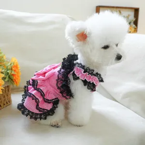 Detail shot of pink gingham pet dress with black lace, perfect for small dogs and cats style.