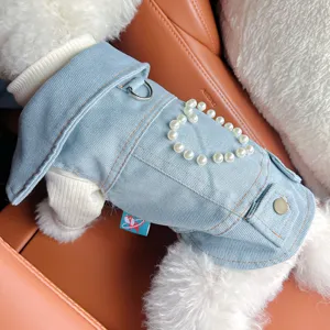 Detailed view of cute pet denim jacket featuring pearl heart embellishment for small dogs.