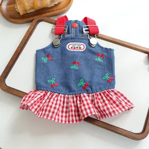 Cute denim pet dress with red straps cherry embroidery and checkered ruffle hem for dogs and cats.