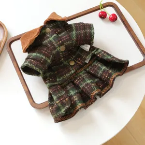 Detail of pet dog plaid dress with brown lapel and pleated skirt for autumn winter.