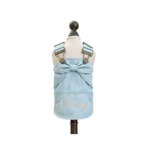 Cute pet denim dress for dogs and cats with lovely bow and metal straps, sleeveless design main.