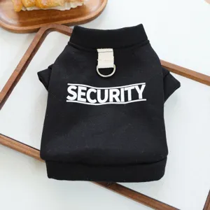 Black pet dog hoodie detail view featuring security letter print and metal leash ring on back.