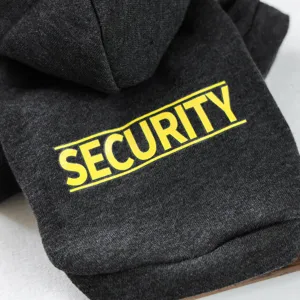 Close-up view of dark grey pet hoodie detail featuring yellow security letter print.