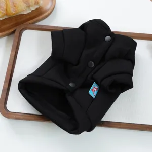 Black pet hoodie detail shot, comfortable cotton dog clothes with convenient snap buttons.