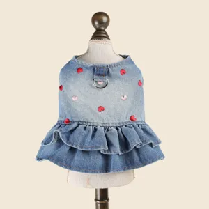 Cute pet denim dress detail, embroidered heart pattern with metal d-ring and ruffle hem.