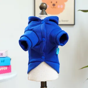 Detail view of blue pet hoodie with hood and buttons for small dogs, soft autumn wear.