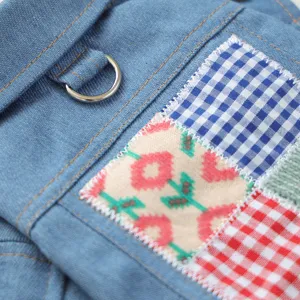 Blue denim pet clothing main shot showcasing lapel, metal D-ring leash buckle and patchwork.