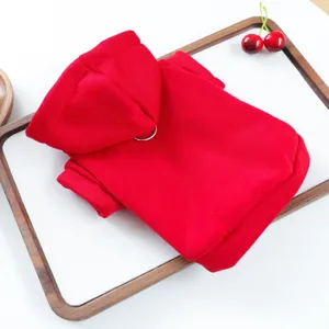 Detail shot of red pet hoodie with hood and ring, cozy dog apparel for small pets.