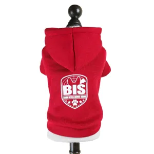 Close-up detail of red pet hoodie with cozy hood and stylish back graphic print.