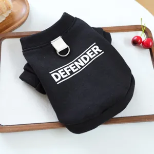 Detailed close-up of black pet hoodie with D-ring and bold letter print design.