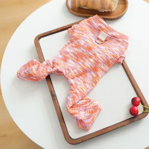 Detailed view of colorful knitted pet clothes with leash ring for small dogs, cozy daily wear.